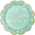 plato estampado flores rosa y amarillas con fondo verde