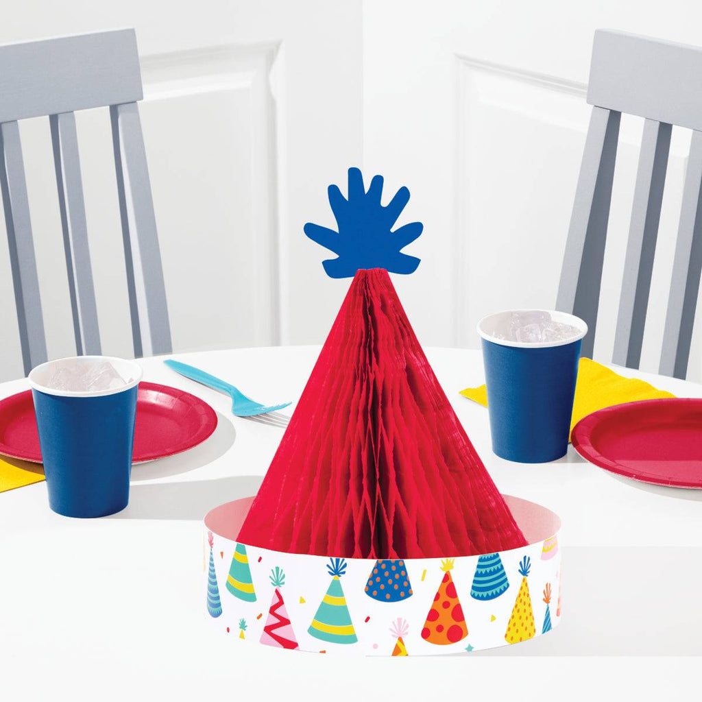 Centro de mesa gorro de cumpleaños Make a Wish con diseño retro en colores vivos, ideal como decoración para fiestas de adultos nostálgicas.
